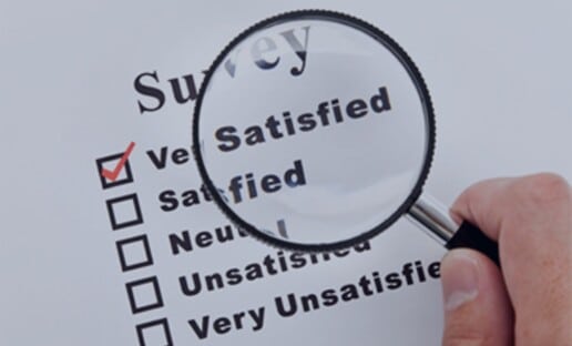 magnifying glass over cx surveys