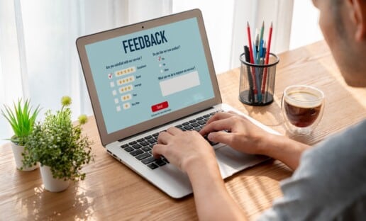 person taking a survey from a net promoter score company like Interaction Metrics