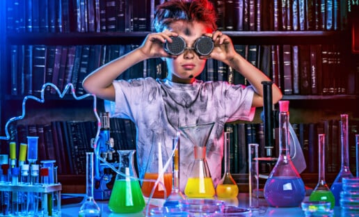 A boy doing experiments in the laboratory.