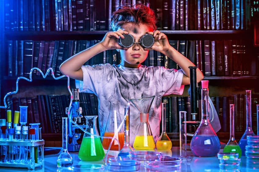 A boy doing experiments in the laboratory.