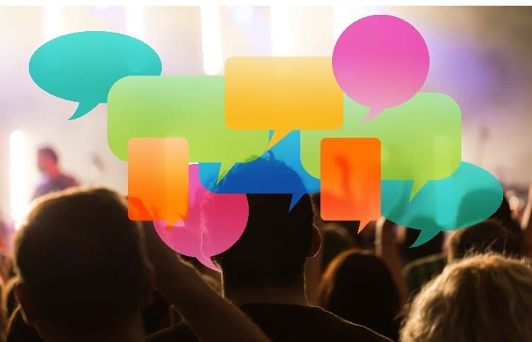 Customer feedback image showing colorful speech bubbles over a crowd, representing customer opinions and survey responses.